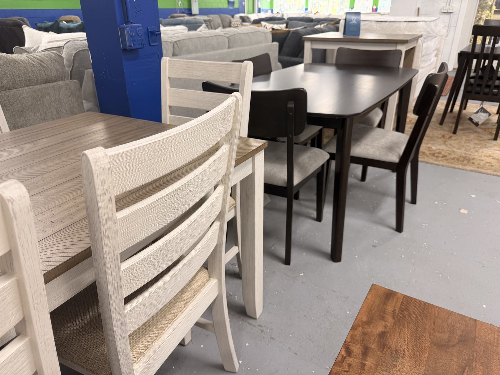 Dining tables & chairs on our showroom floor